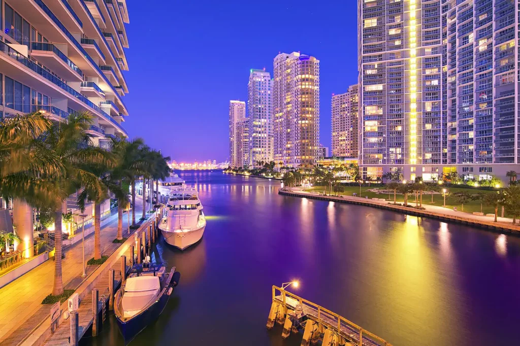 "Skyline view of Brickell, Florida, featuring luxury high-rise buildings and the Miami River, showcasing the vibrant urban lifestyle and real estate opportunities in the area."